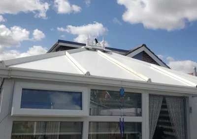 Completed conservatory roof insulation by insulated conservatory roof panels