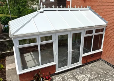 Completed conservatory roof insulation by insulated conservatory roof panels